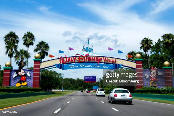 Vehicles pass the entrance to the Walt Disney World theme park and resort in Lake Buena Vista, Florida, U.S., on Monday, Aug. 31, 2009. Walt Disney...
