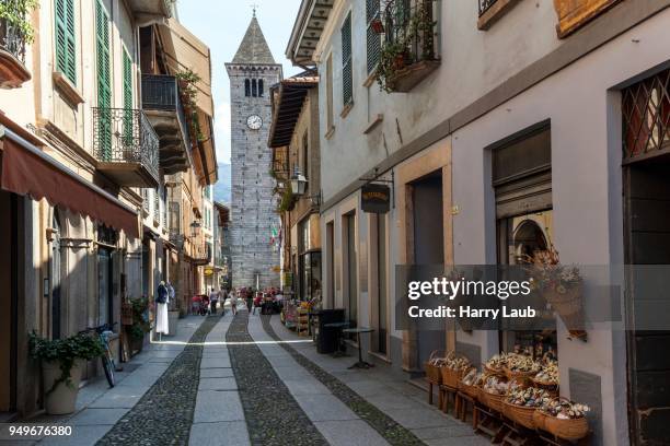 street in the old town of cannobio, in the back the steeple of the catholic church, lago maggiore, verbano-cusio-ossola province, piedmont region, italy - province of verbano cusio ossola stock pictures, royalty-free photos & images