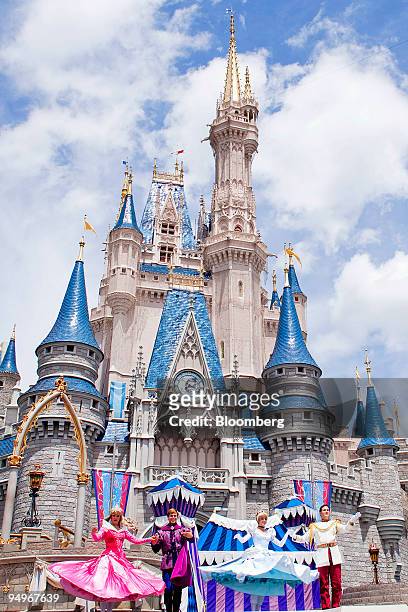 Actors take part in a performance in front of Cinderalla Castle at Magic Kingdom, part of the Walt Disney World theme park and resort in Lake Buena...
