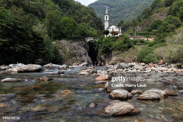 river cannobino at the end of the sant anna ravine, in the background the church of orrido sant anna, cannobio, verbano-cusio-ossola province, piedmont region, italy - province of verbano cusio ossola stock pictures, royalty-free photos & images