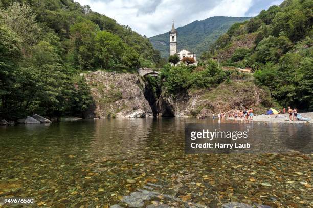 river cannobino with bathing place at the end of the gorge of sant anna, in the baclground the church of orrido sant anna, cannobio, verbano-cusio-ossola province, piedmont region, italy - province of verbano cusio ossola fotografías e imágenes de stock