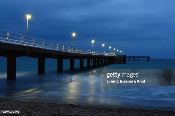 blue hour sea bridge, timmendorfer strand, baltic sea, schleswig-holstein, germany - timmendorfer strand stock-fotos und bilder