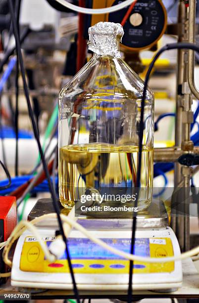 Jug of ammonium hydroxide is weighed and monitored in a fermentation lab at the Cubist Pharmaceuticals production facility in Lexington,...