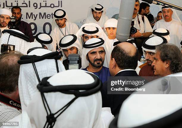 Sheikh Mohammed Bin Rashid Al Maktoum, Dubai's ruler and vice president of the United Arab Emirates, center, speaks to the media at the inaugural of...