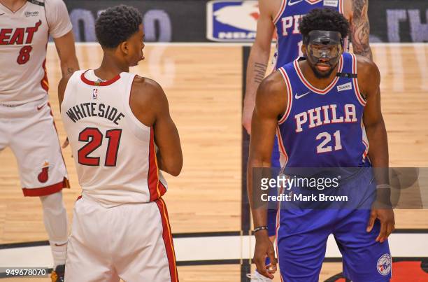 Hassan Whiteside of the Miami Heat gets ready to tip off against Joel Embiid of the Philadelphia 76ers in the first quarter during Game Four of Round...