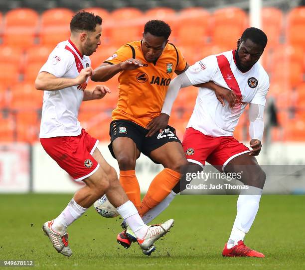 Robbie Willmott, Frank Nouble of Newport County AFC and Jean-Louis Akpa Akpro Barnet FC compete for the ball during the Sky Bet League Two match...