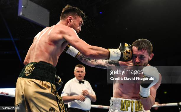 Belfast , Ireland - 21 April 2018; Tyrone McKenna, left, in action against Anthony Upton during their Super-Lightweight bout at the Boxing in SSE...