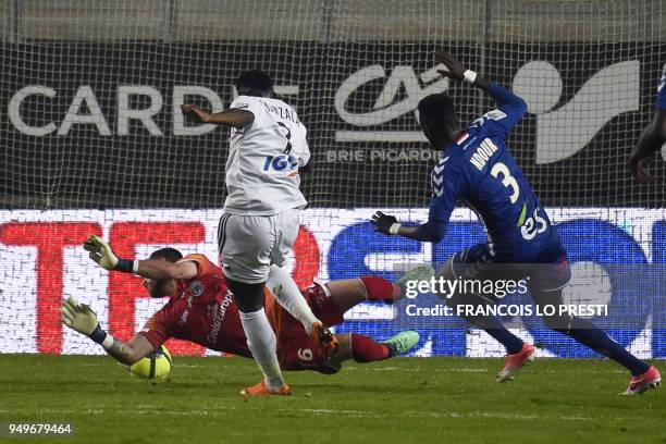 Amiens' Congolese midfielder Harisson Manzala shoots and scores a goal during the French L1 football match between Amiens and Strasbourg on April 21...