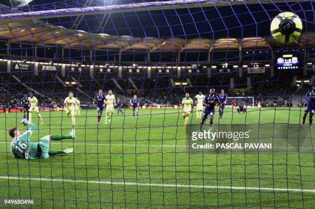 Toulouse's Ivorian forward Max-Alain Gradel scores a penalty kick past Angers' French goalkeeper Ludovic Butelle during the French L1 football match...