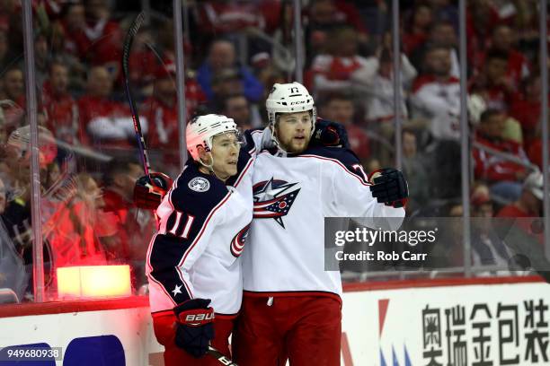 Matt Calvert of the Columbus Blue Jackets celebrates with Josh Anderson after scoring a first period goal against the Washington Capitals during Game...
