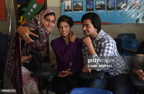 Pakistani teacher Eeman takes selfie with students on the first day of the first transgender school in Lahore on April 21, 2018. - The school, 'The...