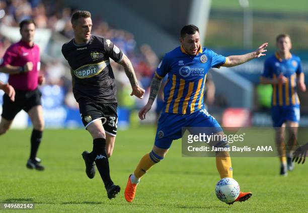 Peter Clarke of Bury and Nathan Thomas of Shrewsbury Town during the Sky Bet League One match between Shrewsbury Town and Bury at New Meadow on April...