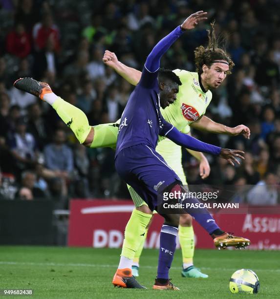 Toulouse's French forward Yaya Sanogo vies with Angers' French defender Mateo Pavlovic during the French L1 football match between Toulouse and...