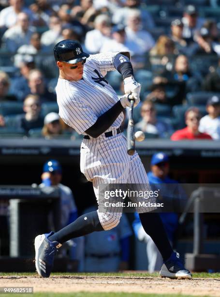 Aaron Judge of the New York Yankees connects on a sixth inning RBI single against the Toronto Blue Jays at Yankee Stadium on April 21, 2018 in the...