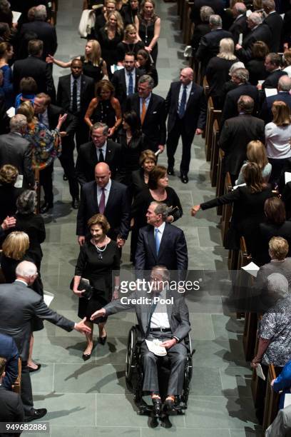 Former president George H.W. Bush, former president George W. Bush, former first lady Laura Bush and family leave St. Martin's Episcopal Church...