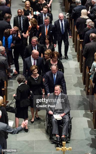 Former president George H.W. Bush, former president George W. Bush, former first lady Laura Bush and family leave St. Martin's Episcopal Church...