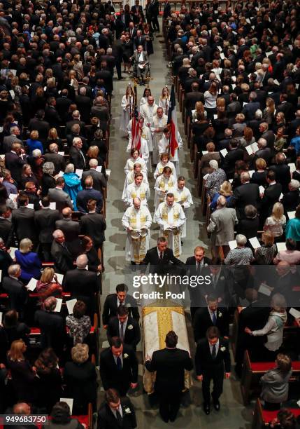 Pallbearers carry the coffin of former first lady Barbara Bush during funeral services at St. Martin's Episcopal Church on April 21, 2018 in Houston,...