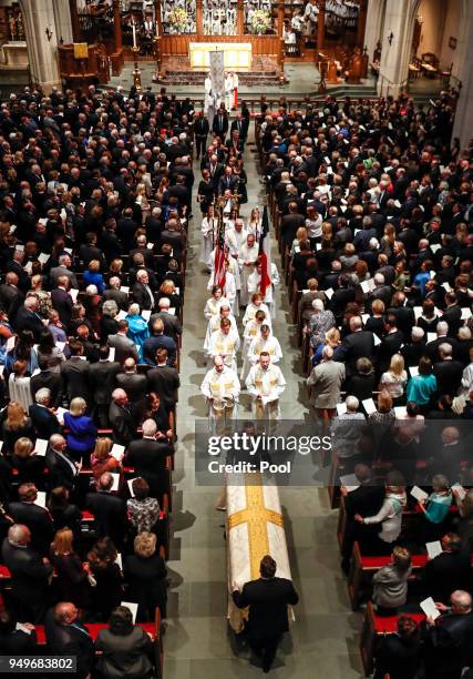 Pallbearers carry the coffin of former first lady Barbara Bush during funeral services at St. Martin's Episcopal Church on April 21, 2018 in Houston,...