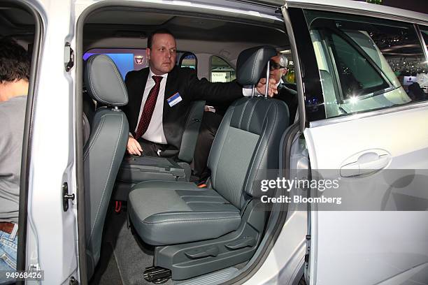 Ford Employee Andrew Mottram shows the Ford Grand C-Max automobile on the first press day of the Frankfurt Motor Show, in Frankfurt, Germany, on...