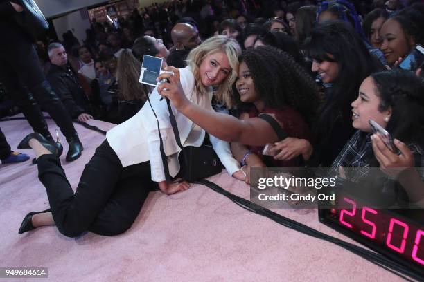 Paris Hilton poses with fans during her panel at Beautycon Festival NYC 2018 - Day 1 at Jacob Javits Center on April 21, 2018 in New York City.