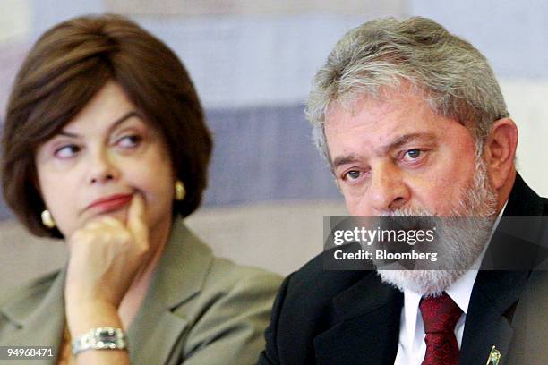 Dilma Rousseff, left, chief of staff to Brazilian President Luiz Inacio Lula da Silva, listens during a meeting with Lula, right, and his economic...