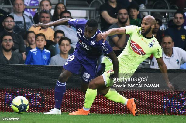 Toulouse's Brazilian midfielder Somalia vies with Angers' Ivorian forward Thomas Toure during the French L1 football match between Toulouse and...