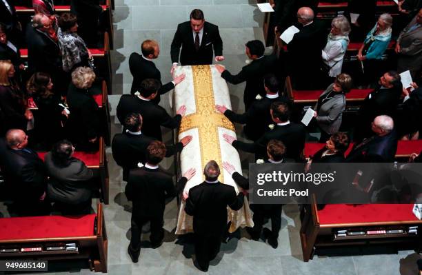 Pallbearers escort the coffin of former first lady Barbara Bush during funeral services at St. Martin's Episcopal Church on April 21, 2018 in...