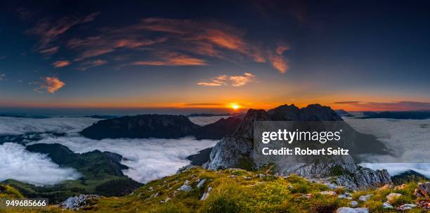 mountain peak with sea of fog at sunrise, wilder kaiser, scheffau, tyrol, austria - kaiser fotografías e imágenes de stock