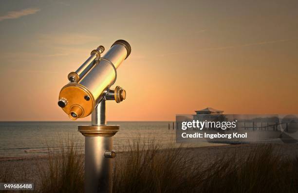 telescope at timmendorfer strand, teehaus auf seebruecke at sunrise, baltic sea, schleswig-holstein, germany - timmendorfer strand stock-fotos und bilder