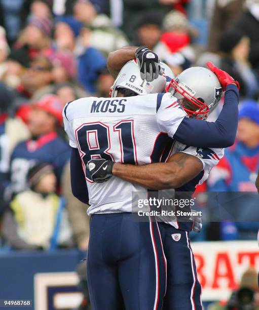 Randy Moss and Sammy Morris of the New England Patriots celebrate Moss's touchdown in the second quarter against the Buffalo Bills at Ralph Wilson...