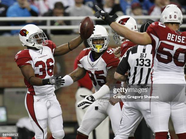 LaRod Stephens-Howling of the Arizona Cardinals celebrates recovering a first quarter dropped punt with Monty Beisel and Ali Highsmith while playing...