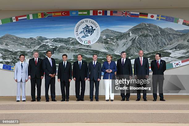 The members of the G8 pose for a family photo, left to right, Taro Aso, Japan?s prime minister, Stephen Harper, Canada?s prime minister, U.S....