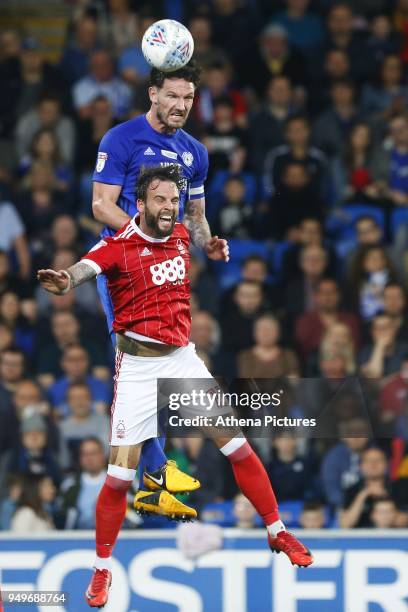 Sean Morrison of Cardiff City wins the header as he contends with Danny Fox of Nottingham Forest during the Sky Bet Championship match between...