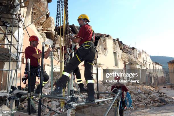 Construction workers rebuild a government building destroyed by an April earthquake in L'Aquila, Italy, on Wednesday, July 8, 2009. Group of Eight...