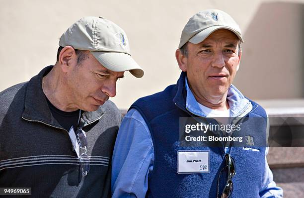 Kenneth Starr, chairman and chief executive officer of Starr & Co., left, walks with James Wiatt, chairman of the William Morris Agency, during the...