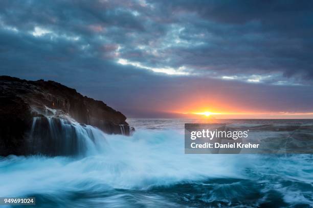 surf, rocky coast with foaming waves at sunset, puerto de la madera, tacoronte, tenerife, canary islands, spain - madera stock pictures, royalty-free photos & images