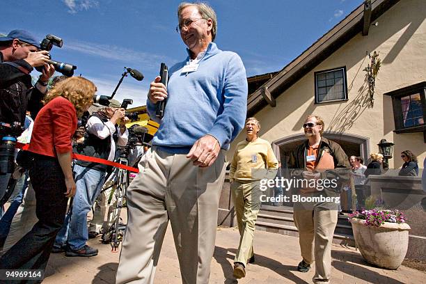 Eric Schmidt, chairman and chief executive officer of Google Inc., left, walks ahead of Bill Gates, chairman of Microsoft Corp., center, and Nathan...