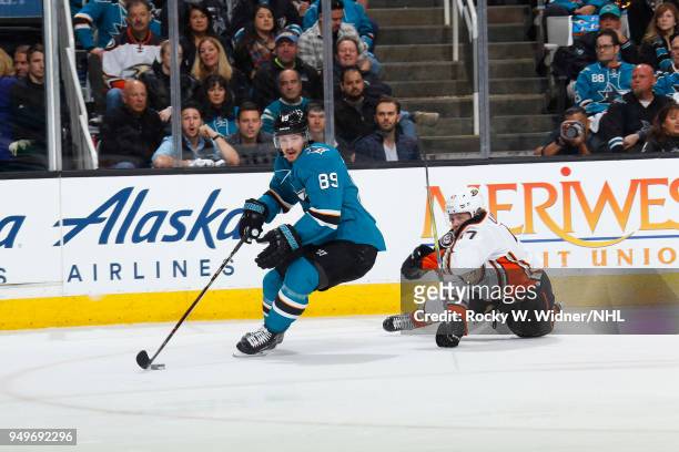 Mikkel Boedker of the San Jose Sharks skates with the puck against Hampus Lindholm of the Anaheim Ducks in Game Three of the Western Conference First...