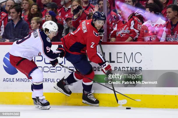Matt Niskanen of the Washington Capitals controls the puck against Artemi Panarin of the Columbus Blue Jackets in the second period in Game Five of...