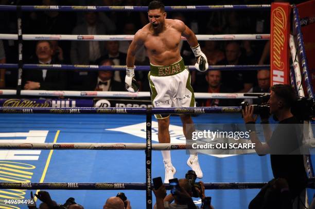 Britain's Amir Khan celebrates defeating Canada's Phil Lo Greco in their Super-Welterweight contest at the Echo Arena in Liverpool, northern England,...