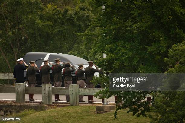 The hearse carrying former first lady Barbara Bush passes through members of the Texas A&M Corps of Cadets as it nears her husband's presidential...