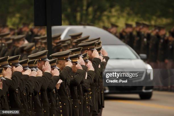 The hearse carrying former first lady Barbara Bush passes through members of the Texas A&M Corps of Cadets as it nears her husband's presidential...