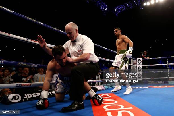 Amir Khan of England looks on as he knocks out Phil Lo Greco of Italy during their Super Welterweight bout at Echo Arena on April 21, 2018 in...