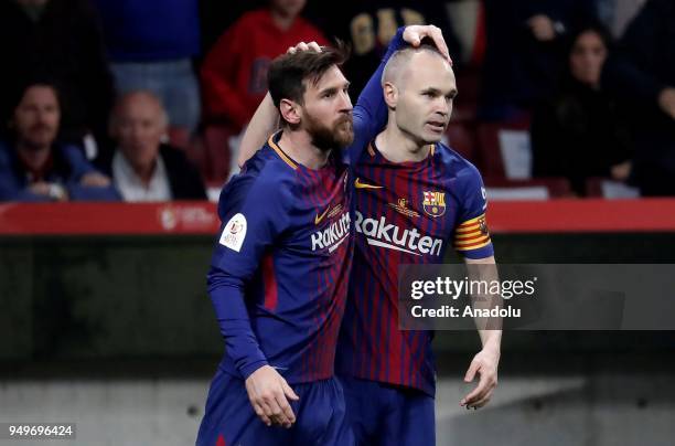 Andres Iniesta of Barcelona celebrates with his teammate Lionel Messi after scoring a goal during Copa del Rey Final soccer match between Sevilla and...