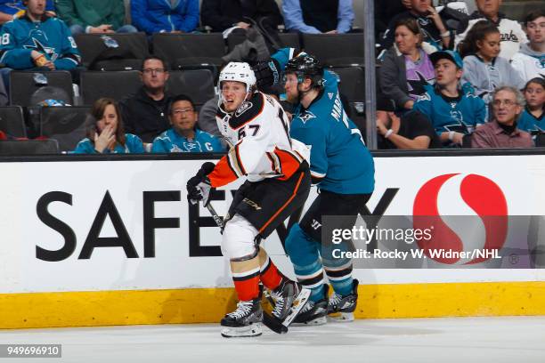 Rickard Rakell of the Anaheim Ducks skates against Paul Martin of the San Jose Sharks in Game Three of the Western Conference First Round during the...