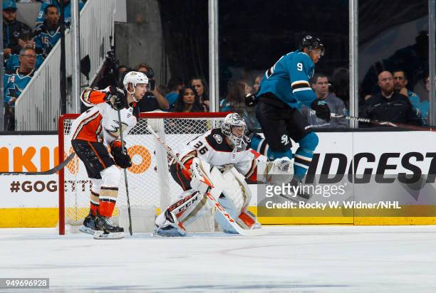 John Gibson of the Anaheim Ducks defends against Evander Kane of the San Jose Sharks in Game Three of the Western Conference First Round during the...