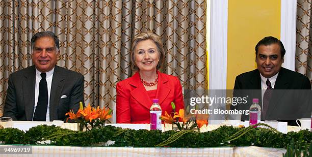 Secretary of State Hillary Clinton, center, along with Ratan Tata, chairman of Tata Group, left, and Mukesh Ambani, chairman and managing director of...