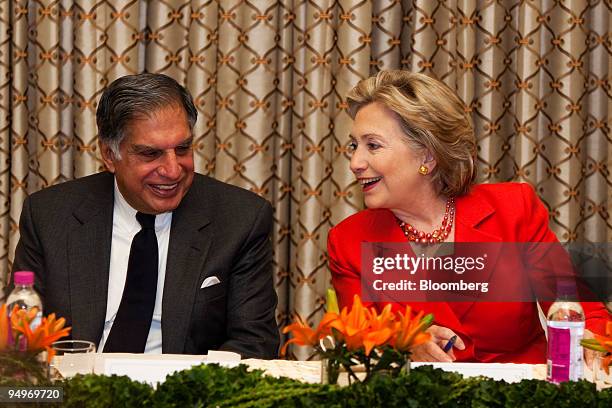 Secretary of State Hillary Clinton, right, attends a news confernece with Ratan Tata, chairman of Tata Group, left, and Mukesh Ambani, chairman and...