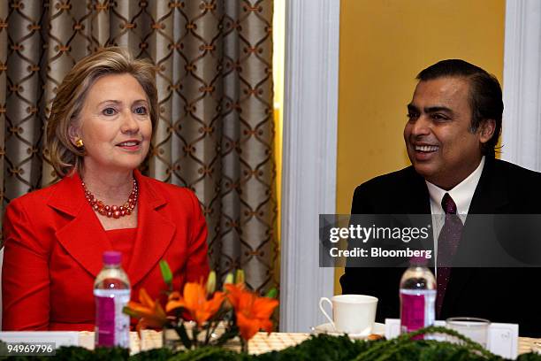 Secretary of State Hillary Clinton, left, attends a news conference with Mukesh Ambani, chairman and managing director of Reliance Industries Ltd.,...