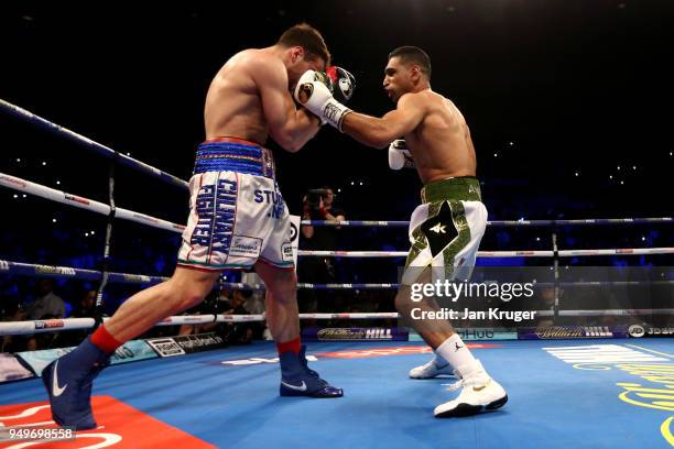 Amir Khan of England knocks out Phil Lo Greco of Italy during their Super Welterweight bout at Echo Arena on April 21, 2018 in Liverpool, England.